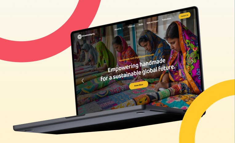 Creative Dignity website on laptop
