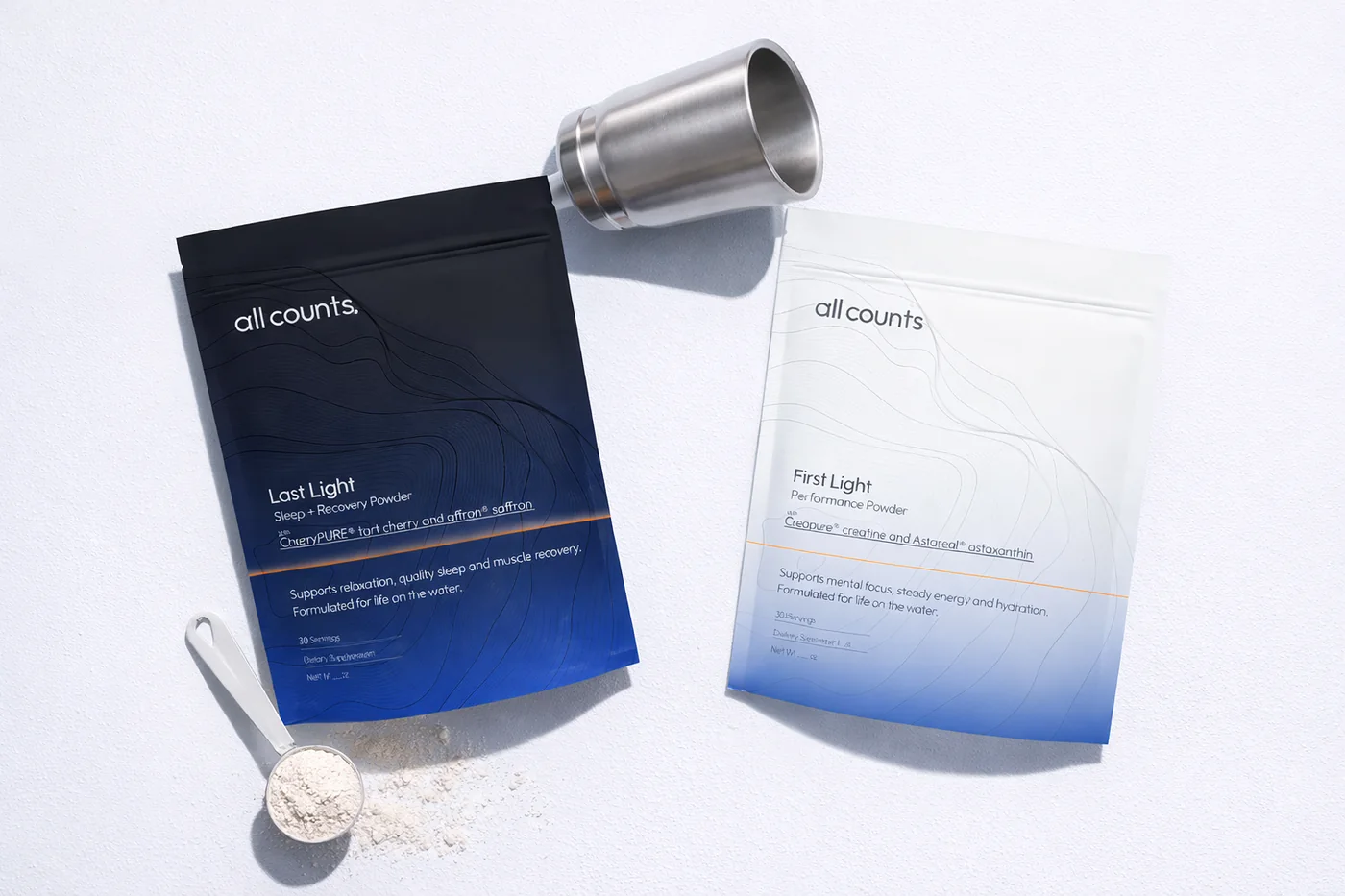 All Counts pouches in a flat lay with a steel shaker and scoop