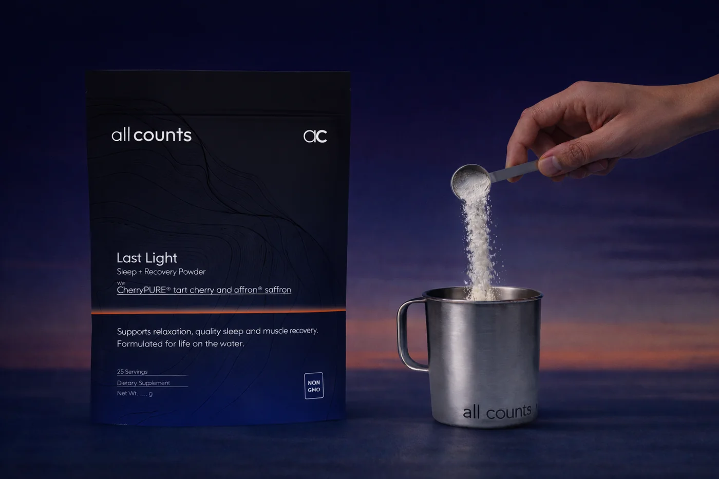 All Counts Last Light pouch with powder poured into a steel mug at dusk